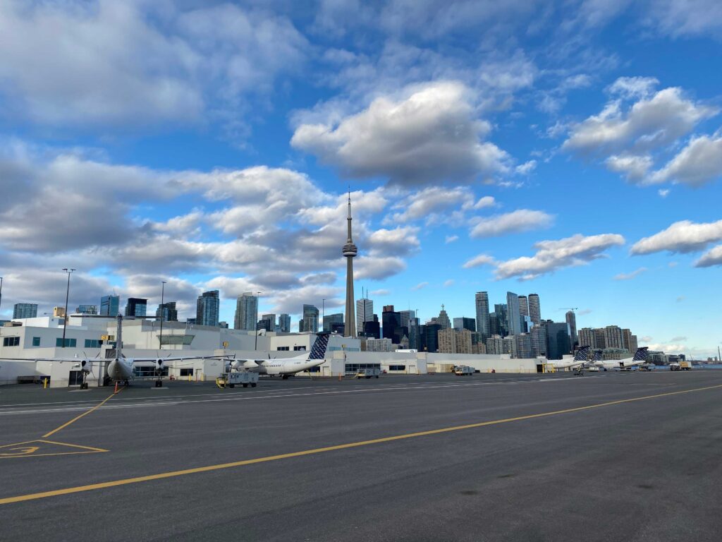 Planes at the gate with city in background