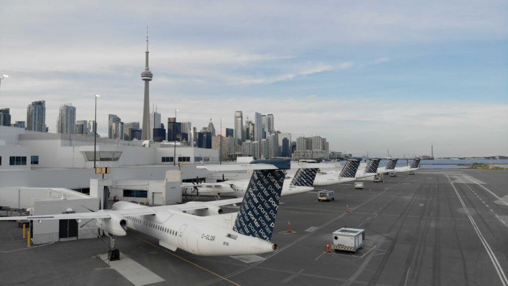 Planes at the gate with city in background