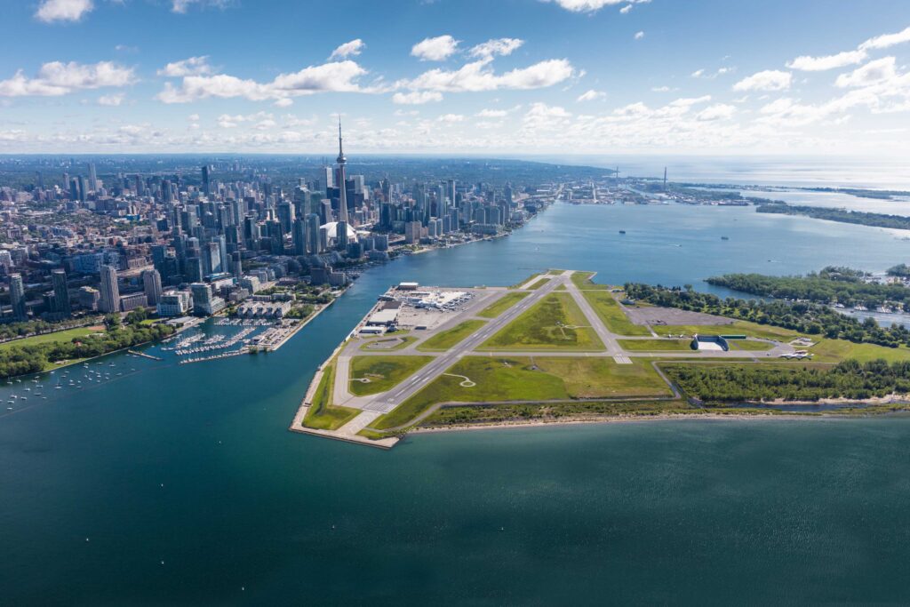 Aerial photo with the airport in the foreground and the city in the background