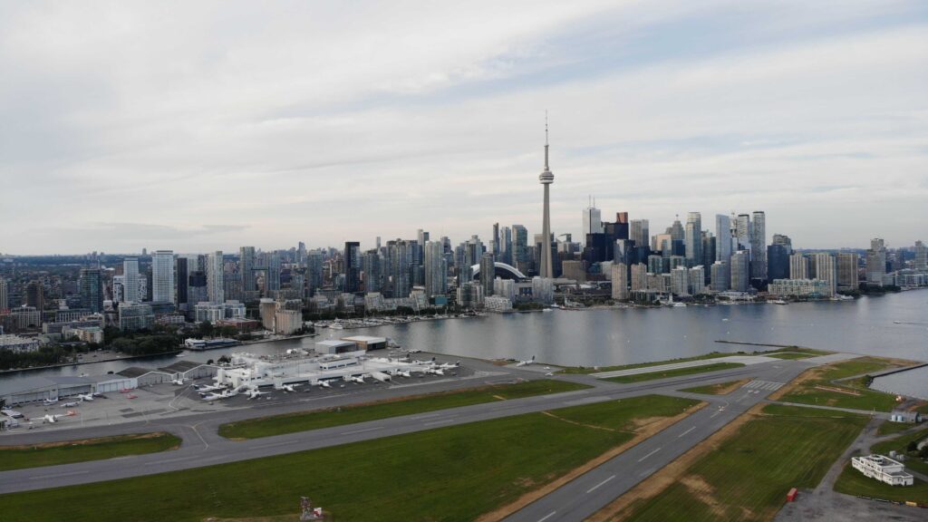 Drone photo of the airport runway with the city in the background