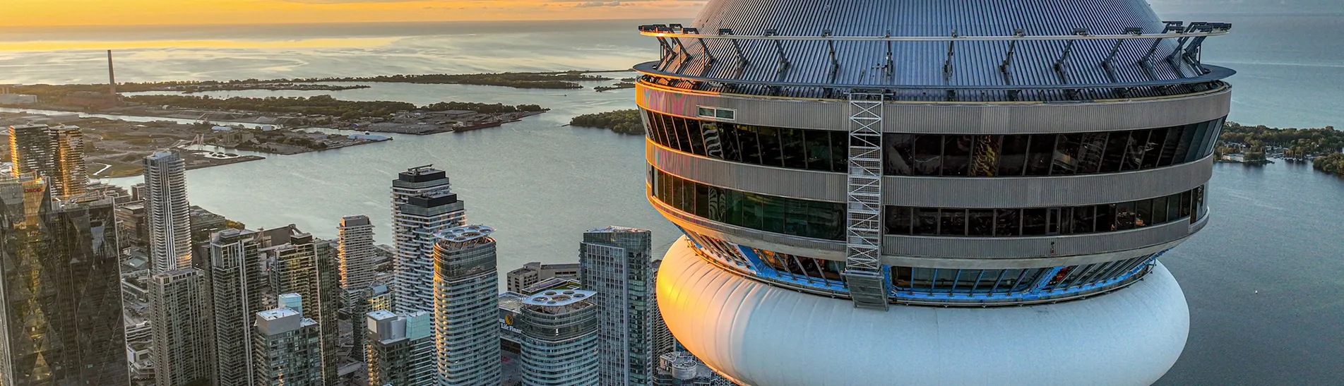 Aerial photo of the CN Tower close up with the city of Toronto down below