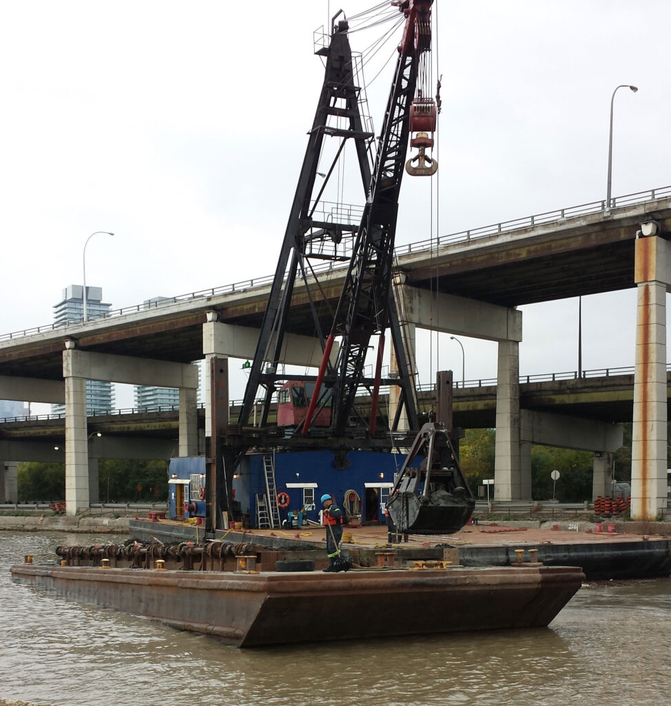 Dredging ship with crane