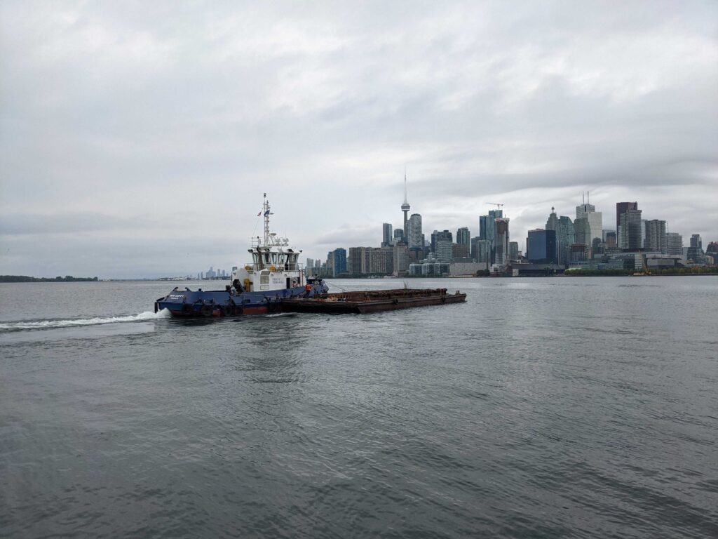 Tugboat with city in background