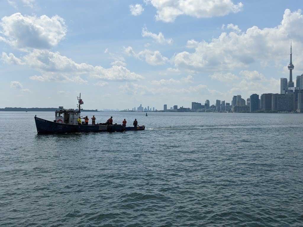 Tugboat with city in background