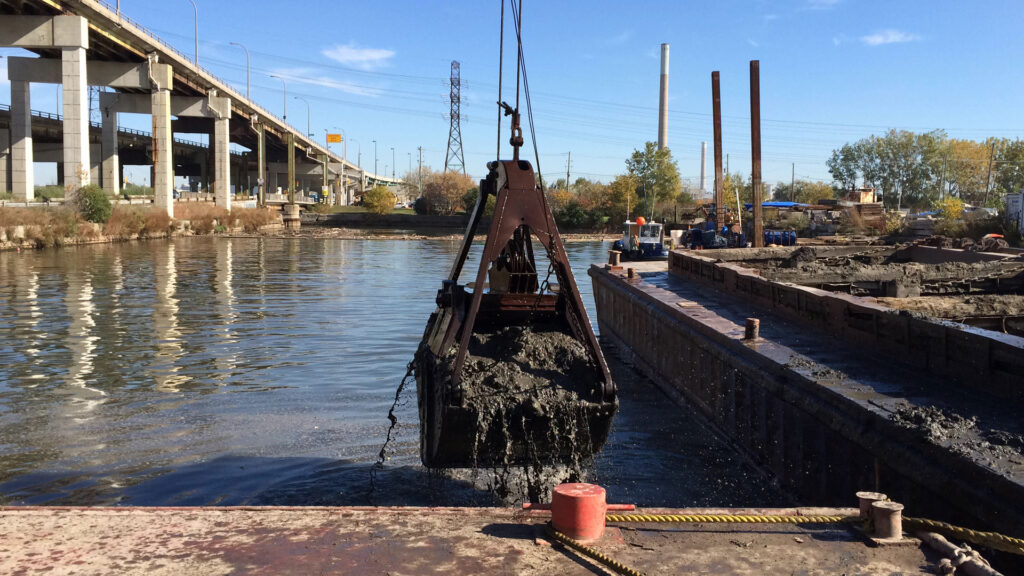 Crane full of dredging material