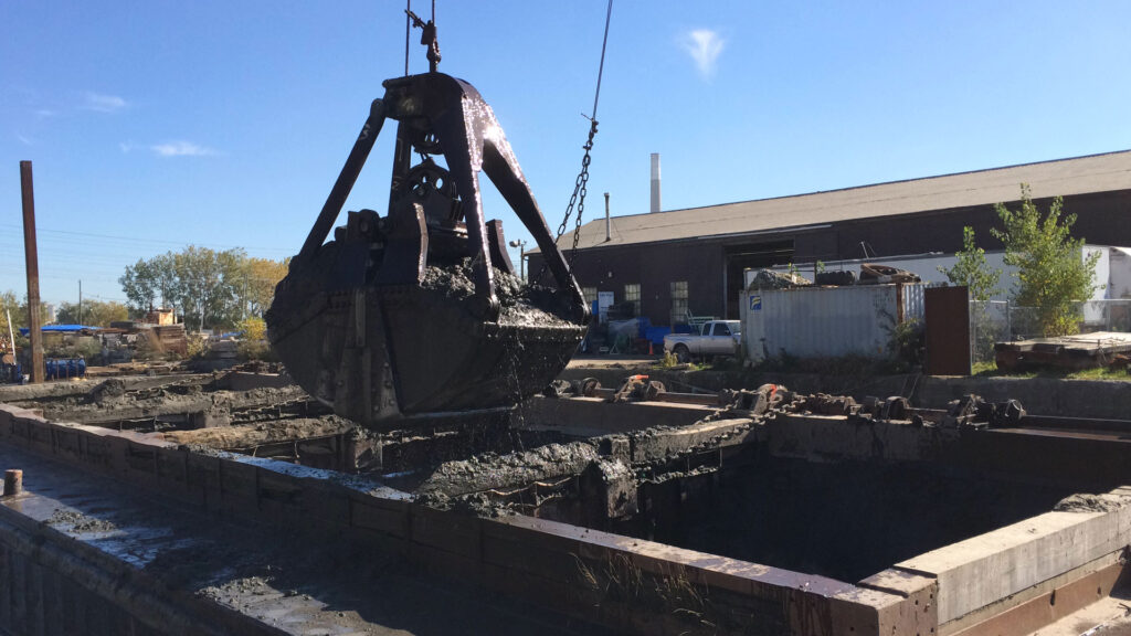 Crane full of dredging material