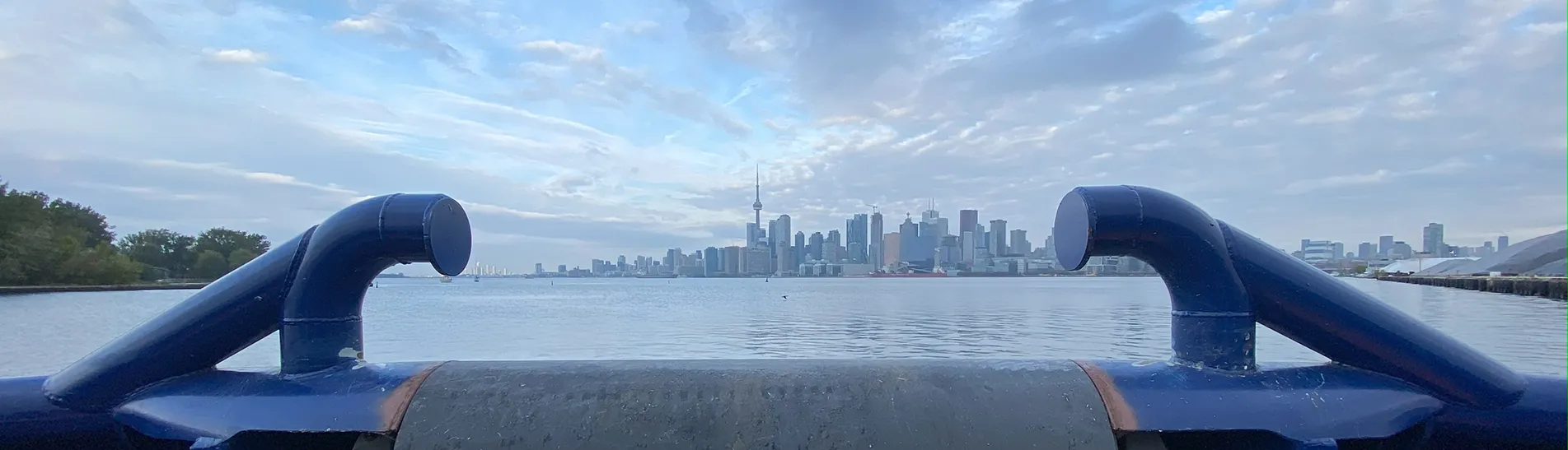 Photo of the Toronto skyline as viewed from a boat on lake Ontario