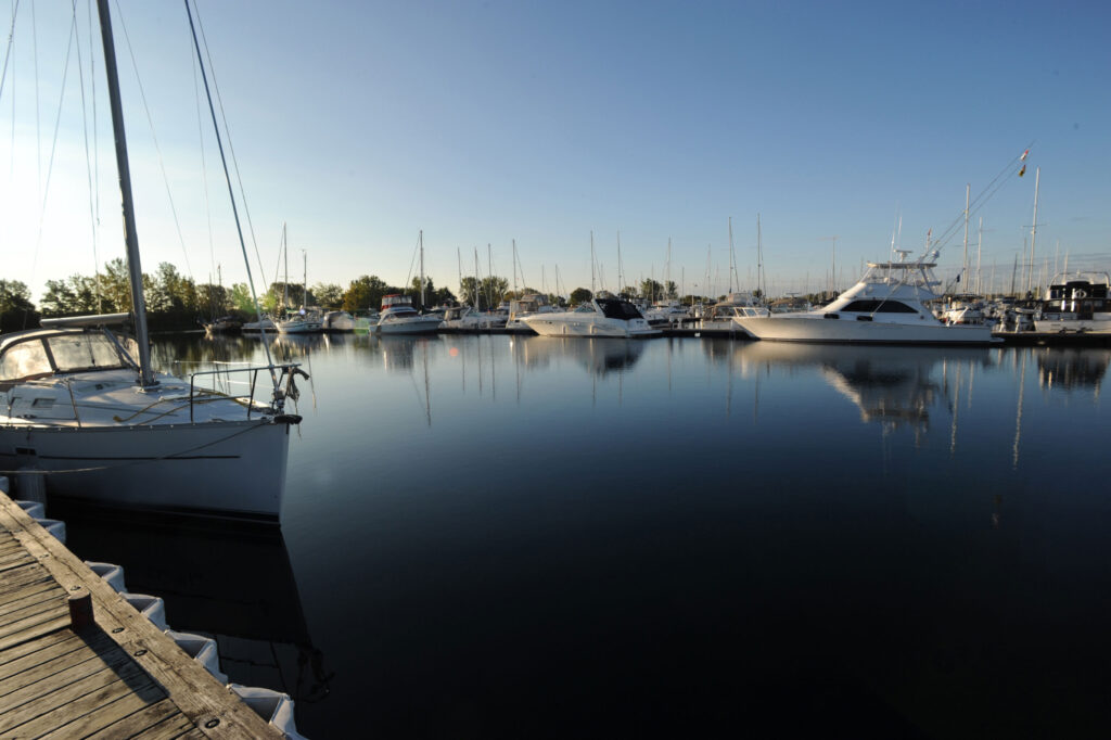 Photo of yacts and sailboats at the dock at the marina