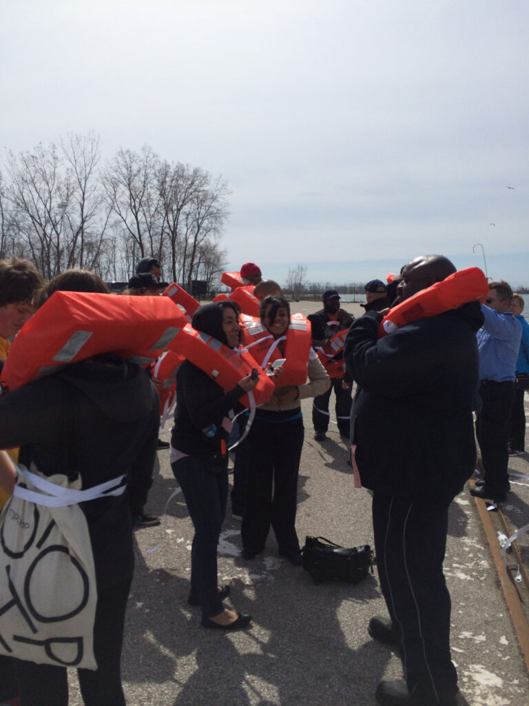 Spectators wearing life vests