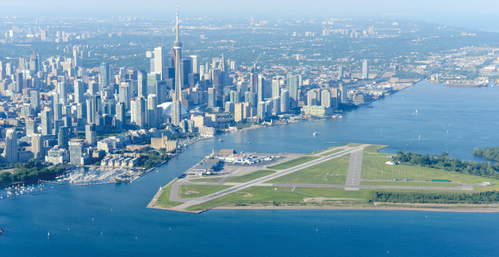 Aerial photo with the airport in the foreground and the city in the background