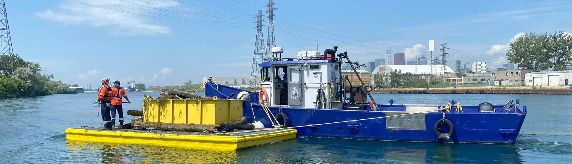 Photo of boats by the Toronto island cleaning the lake