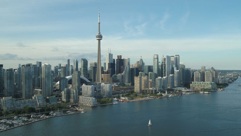 Aerial of city skyline with a sailboat